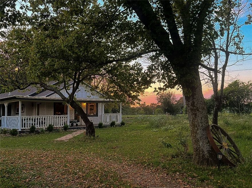 Garden and horse folks, look no further.  This renovated cottage-style farmhouse on 4.11 acres (two lots) is an open plan with all the comforts, including an upgraded tankless water heater and clawfoot tub in the master bath. This tucked-away home has beautiful views and good neighbors. New vinyl plank floors by Stainmaster are guaranteed pet and waterproof.  Bedrooms and living room have modern ceiling fans. With electric appliances, including HVAC, and a new roof.  Wood stove riser has a chimney, but needs hookup. Enjoy a gentle breeze on the wraparound porch overlooking two gardens, apple trees and passion fruit. Established grapevines grow up the carport beside black raspberry and roses with native flowers. A shed with fenced yard is ready for poultry or goats, and the large barn is a blank canvas. Property is fenced, with gates on both ends and at the driveway.  Just 2.5 miles from town and 35 mins to Fayetteville. Come home and set up roots.