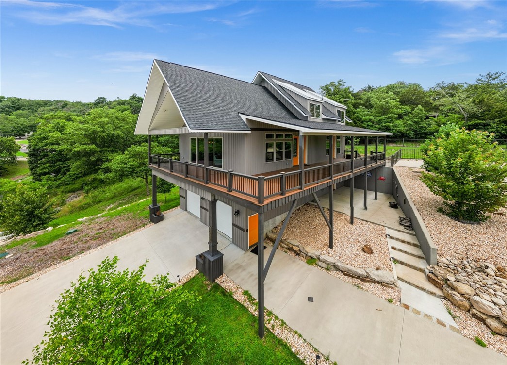 This home has the best of everything...Modern architectural details and a lakeview that will leave you in awe! Residing in the Del Lago Estates of Beaver Lake, this custom built home is exceptionally true to its lakeview character with 3 levels of living space throughout. The main level makes entertaining easy with a spacious living room, dining area and kitchen flowing into each other, creating a welcoming and open atmosphere. The primary suite with bath and walk in closet is located on this level with access to the wraparound deck. Nothing competes with the incredible view! The upstairs includes 2 guest quarters and full bath. Downstairs, a generous living area can also be converted to a 4th bedroom. Mudroom also on this level with ample storage and utility room. Outdoor specs: well-designed landscaping that blends with the natural lakeside environment and a storage shed perfect for all the toys. Located in a prime location this home allows you to fully appreciate the beauty of a lakeview setting.
