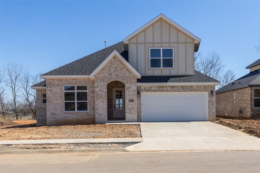 Celebrate the holidays in your new home at Annika Estates! This thoughtfully designed Clifford floor plan offers 4 bedrooms and 4 bathrooms, with 3 bedrooms and 3 bathrooms conveniently located on the main level and an additional bedroom and full bath upstairs. Each bedroom includes its own walk-in closet for exceptional storage. Located near highly rated Bentonville Schools, the upcoming Centerton Downtown and just 15 minutes from the Walmart Home Office, this home provides both comfort and convenience. Interior features include hand-selected designer finishes, 3 cm quartz countertops, custom premium cabinetry, 10' ceilings, luxury vinyl plank flooring in common areas, a modern fireplace, walk-in shower with tile surround in the primary suite, attic storage, and a fully sodded yard.  Annika Homes - Luxury at its best. AGENT OWNED. Picture of a similar home.