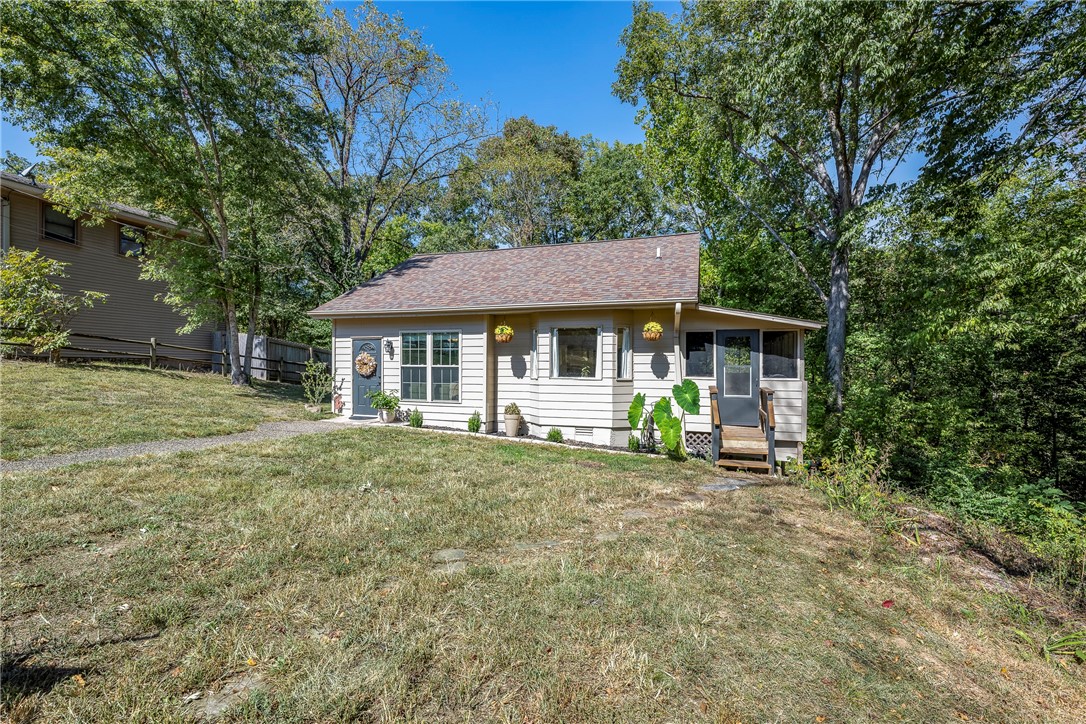 Discover the perfect blend of modern updates and country charm at 1272 Pace Ln in Pea Ridge! A serene wooded backdrop, this 1,066 sq. ft., 3-bed, 1-bath home is a cozy retreat with stylish upgrades. Step inside to find new light fixtures, fresh paint in key living spaces, and a beautifully updated butcher block kitchen countertop. The exterior shines with durable Hardie board siding, ensuring long-lasting appeal. Outside, enjoy peaceful nature views, room to explore, and endless possibilities for outdoor living. Conveniently located with easy access to town, this home is a true hidden gem. Donāt miss outāschedule your showing today!
