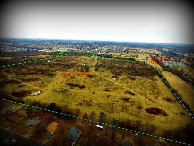 105.90 acres in city limits with development potential, your very own estate, and other opportunities. Joins Razorback golf course on East and part of North line & Holcomb Elementary on West property line. City of Fayetteville approved 280+ lot subdivision in 2009. Additional access from N Woodlark Lane.