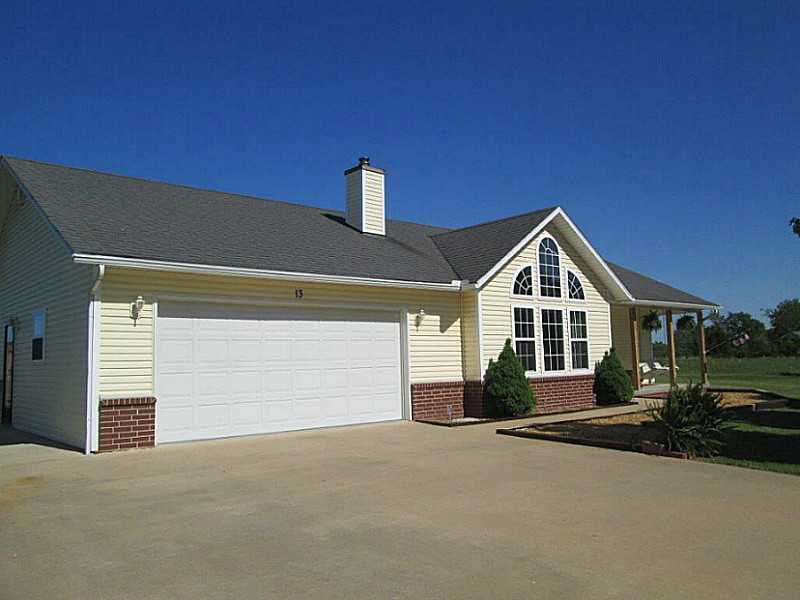 WIDE OPEN COUNTRY FEEL ON A HALF ACRE! A REMARKABLE HOME WITH A MULTITUDE OF FEATURES! REDUCE YOUR ELECTRIC BILLS WITH THE ATTIC FAN. WARM THE HOUSE WITH THE WOOD BURNING FIREPLACE! WATCH THE KIDS PLAY FROM THE GARDEN WINDOW WHILE COOKING IN YOUR,KITCHEN FEATURING TILE FLOORS, STAINLESS-STEEL APPLIANCES, AND A FANTASTIC POT FILLER FAUCET! ABUNDANT STORAGE AND BUILT-INS, MAGNIFICENT LIVING ROOM WINDOWS, AND A 3RD BEDROOM WITH SPACE TO BUILD A CLOSET OR PLACE AN ARMOIRE.
