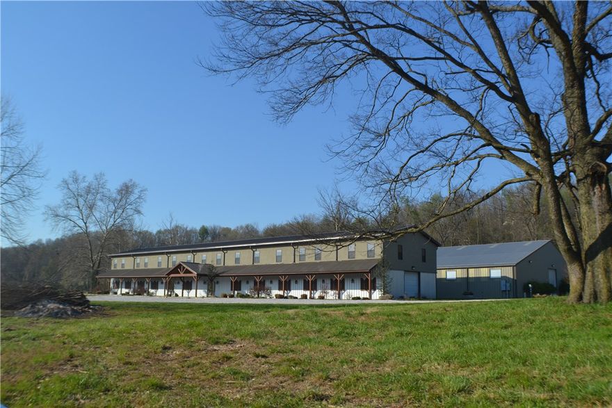 TWIN SPRINGS EQUESTRIAN CENTER: Beautiful custom built horse ranch with 7 paddacks, 12 Priefert stables, 4 grooming bays, a wash bay(all Priefert), tack room, 27,992 Sq ft riding arena with sound system, an office, 2 private apartments 1640sq ft each plus 3936 sq ft heated & cooled unfinished office/recreation area between the two private living areas. All of this on 123 acres with a creek, incredible views with great home site possibilities.