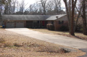 Country charmer minutes from town! This 2000+ sq/ft home has natural hardwood floors throughout. Located right on the edge of Russellville, you aren't far from shopping, medical, or dining and with over an acre, the kids have plenty of place to play! Large deck out back, woodburning insert in living area w/vaulted ceiling, new windows, 2 yr old heat and air and much more!
