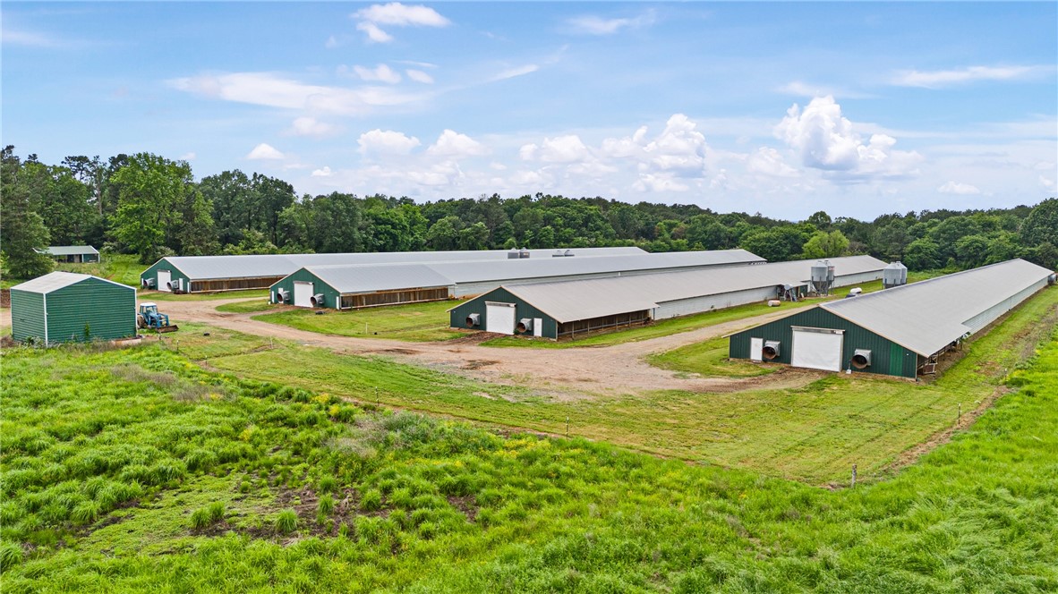 Turn-Key 4-House Wayne Broiler Farm on 70± Acres
This fully operational poultry farm offers exceptional income potential and scenic beauty. Featuring (4) 43’x500’ broiler houses with Choretime controls, waterers, and feed lines, this farm is designed for efficiency and ease of operation. Additional improvements include a 40’x105’ litter shed, 30’x20’ water room with (4) 5,100-gallon water tanks, two Deutz generators, and (4) 1,000-gallon propane tanks ensuring seamless production. Stocked pond for fishing. The surrounding lush hay meadows planted in rye and mixed grasses add value and versatility to the property. Enjoy breathtaking views of Mt. Magazine while benefiting from an average annual income of approximately $250,000.
An outstanding opportunity to own a proven and profitable farm.