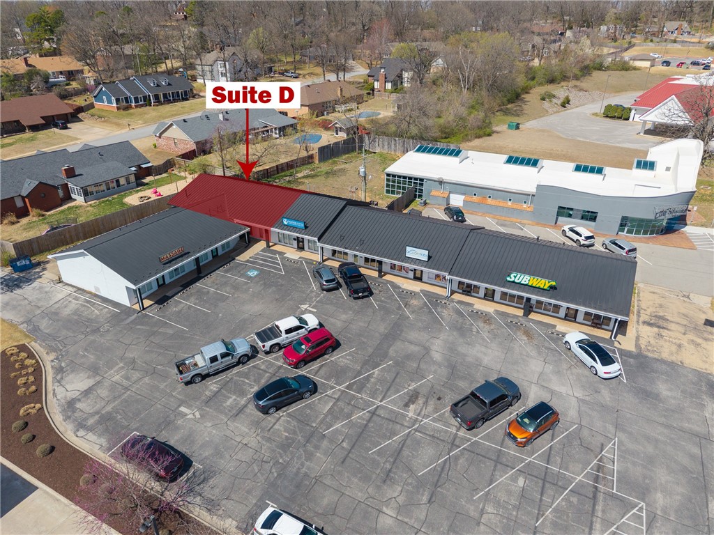 This +/- 1,600 SF office space is ideally situated just off S Thompson St, a high-traffic area with approx. 35,000 VPD. The layout includes a welcoming reception area, a versatile conference room or open workspace, two private offices, another large room that could be an office or an additional meeting room, a breakroom with a kitchenette, and two private restrooms. Additionally, the suite offers three separate entry/exit doors for convenience. Located just 2 miles from the Northwest Arkansas Mall and approx. 3.5 miles from I-49, this space provides excellent accessibility. It is available under a NNN lease structure with a minimum 3 year term, and tenant is responsible for any separately metered utilities in their name. Don't miss out on this opportunity in a high-traffic and accessible location!