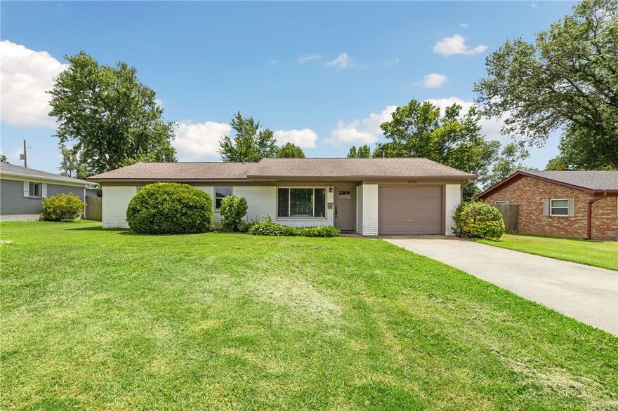 Settle into the heart of Bentonville with this ranch home on a large lot. Nestled on a generous lot, this property offers the space and privacy you desire, without sacrificing the urban energy you love. The home’s classic architecture is complemented by modern updates, creating a comfortable and stylish living space.  Gather around the fireplace in the cozy den on a cool evening, or spend your mornings on the expansive lot, soaking up the tranquility. The true luxury of this home, however, is its location. A short stroll or bike ride connects you to everything Bentonville has to offer. Imagine walking to a new exhibit at Crystal Bridges, grabbing a coffee on the Square, or commuting to the new WM Headquarters or AWSOM—all from your front door.