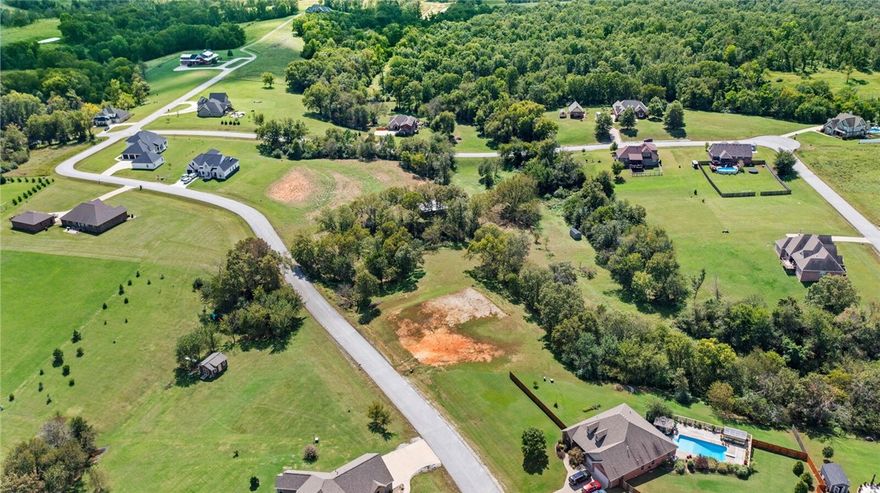 Discover the perfect homesite in the desirable Forest Hills Subdivision of Siloam Springs. This 2.8± acre property offers a beautiful building pad with all utilities in place—everything has been completed for your brand-new home to be built with ease. The property also includes a new insulated barn with roll-up doors, and ready for electricity, ideal for storage, hobbies, or a workshop. With its spacious layout, established utilities, and Stunning community, this lot is ready for your vision to come to life. Conveniently located just minutes from schools, shopping, and all that Siloam Springs has to offer. Additionally it is close enough to work and enjoy all Bentonville/NWA has to offer. Mallory Xing combines the peace of a rural setting with the benefits of city amenities.