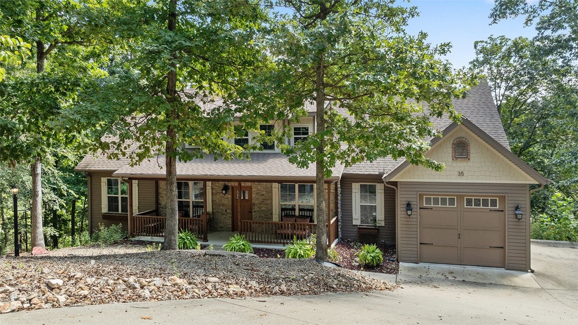 Rare chance to own a Bella Vista lakefront retreat on Lake Rayburn—just 10 miles from Walmart Headquarters and steps from the Back 40 Trail in Bella Vista. This custom-built home has been a successful vacation rental, blending comfort, charm, and functionality. Inside, you’ll find an open layout with soaring windows, a cozy loft, a lower-level rec room, and high-end finishes throughout. Step outside to multiple decks with sweeping views, or head down to your private dock for swimming and fishing. The expansive double lot sits at the end of a quiet cul-de-sac and borders POA common land, giving you extra privacy and room to breathe. Whether you keep it as a proven rental property or make it your personal getaway, you’ll enjoy the best of Bella Vista—fishing, biking, hiking, nature, and community amenities—just 15 minutes from downtown Bentonville. Furnishings are negotiable.