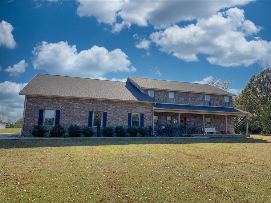 Gorgeous 3330 SF custom home on 5 AC in great location. 5 BR, 3 full BA & half BA. Primary BR downstairs w/access to large covered back patio. Features walk-in closet w/shelves. Primary BA has walk-in shower w/double shower heads, seating area, double vanities. Open plan in kitchen/living area, sliding door overlooks patio & wood burning stove on custom brick work. Kitchen has granite countertops, custom cabinetry, pantry, 5-burner gas stove, double ovens, 2 sink disposals, huge 5x11 island w/cabinets on both sides. Laundry area w/custom built-in mud bench. 4 BR upstairs w/2 jack & jill BA, walk-in closets w/bonus area. Storage in attic & under the stairs. Sprawling 2100 SF 3 car garage, 10x10 doors & 4th door for toys/equip. Garage has wood burning stove, additional full BA (unfinished shower). 2400 SF detached shop w/RV access & 750 SF, 1 BR fully equipped apartment. 50x200 dog run. Too much to list, see attachment.