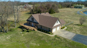 Looking for a well-maintained home with some space in Pottsville Schools? This one is it! This 2500 square foot home has 3 bedrooms, 2 bathrooms, and sits on approximately 1.5 acres and has lots of great other features: A finished room (unconditioned) off of the garage that could be a great office or hobby/storage room, smaller fenced in area for pets, large master suite with two additional rooms that could be theater room/guest area/office/game rooms. This home is situated between Russellville and Pottsville with quick access to both locations. Roof and on demand hot water heater are recent updates to the home along with additional custom cabinets with accent lighting, large utility room, Large wrap around deck and covered patio.