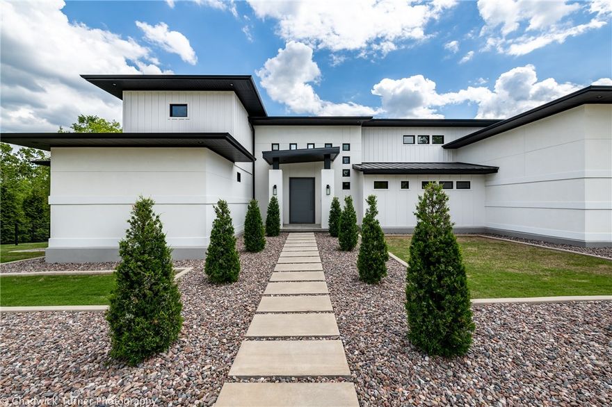 If you love nature, own a stellar art collection, or just have an affinity for the color white, then this modernist style house is the perfect home for you. This elegant, streamlined structure combines clean lines, sleek surfaces, industrial touches and a deep connection to the outdoors through the lens of long stretches of glass throughout. 
This home exudes the “wow” factor from the moment your step inside with a myriad of custom design features…from the steel pivot front door, a steel and wood floating staircase, elite Kahrs ash alabaster wood floors, a kitchen boasting high end appliances with a sweeping center island that overlooks the spacious open floor plan filled with indoor and outdoor spaces for easy flow entertaining. - A great home for the most discerning buyers. Gated access & Control 4 sound system.