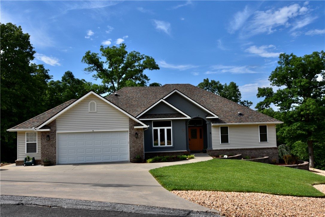 This gem is a must-see! Located in a cul-de-sac with an extra lot, this property is loaded with upgrades! Mini-splits in garage and sunroom, Pella windows installed in 2019, Trex Deck system with screened-in porch installed in 2022, french drains, built-in sprinkler system, crawl space has encapsulation system installed in 2022, water filtration system, to name a few. Close to all the outdoor beauty Bella Vista has to offer. The walk-out basement is a perfect spot for entertaining. This property is one to be desired! Call today to schedule your showing!