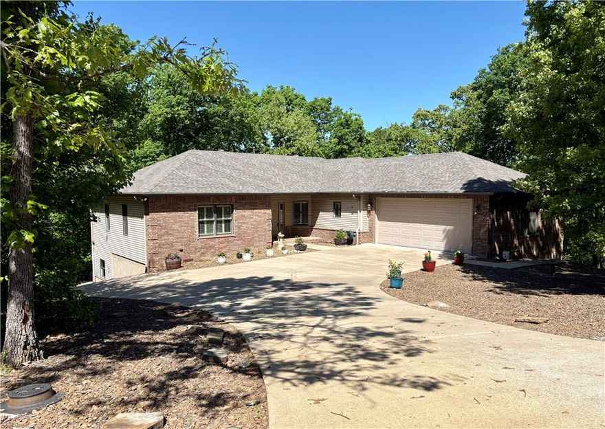 Tucked among mature trees on 1.28 acres, this OAK custom-built home invites a lifestyle of peace, purpose, & possibility. Morning coffee feels different in the sunroom—surrounded by treetop views that change w/the seasons—then spills out onto composite decking built for slow evenings & quiet reflection. Thoughtfully designed with 9’ ceilings, Pella metal-clad windows, geothermal heating/cooling, & instant hot water, the home blends comfort w/craftsmanship. New roof (summer ‘25) adds peace of mind. The heated & cooled 1,000+ sqft workshop is a dream come true—professional grade woodworking equip, high-ceilings, well lit, & accessible to the covered porch & paved drive, making this shop a year-round attraction. The partially finished lower level offers an office, 1/2 bath, utility room, & flex space, w/the potential to add finished flooring to increase overall square footage & value. This is more than a home—it’s a place to create, unwind, & truly live. **Seller offering 7K in Concessions**  Home pre-inspected.