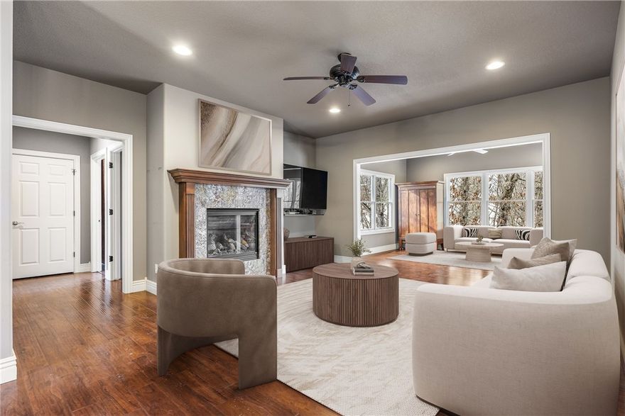 Tucked among mature trees on 1.28 acres, this OAK custom-built home invites a lifestyle of peace, purpose, & possibility. Morning coffee feels different in the sunroom—surrounded by treetop views that change w/the seasons—then spills out onto composite decking built for slow evenings & quiet reflection. Thoughtfully designed with 9’ ceilings, Pella metal-clad windows, geothermal heating/cooling, & instant hot water, the home blends comfort w/craftsmanship. New roof (summer ‘25) adds peace of mind. The heated & cooled 1,000+ sqft workshop is a dream come true—professional grade woodworking equip, high-ceilings, well lit, & accessible to the covered porch & paved drive, making this shop a year-round attraction. The partially finished lower level offers an office, 1/2 bath, utility room, & flex space, w/the potential to add finished flooring to increase overall square footage & value. This is more than a home—it’s a place to create, unwind, & truly live. **Seller offering 7K in Concessions**  Home pre-inspected.