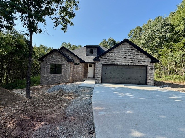 Spacious 2 bedroom and an extra room for an office, 2 bath home with a 2-car garage, offering 1,709 sq ft of comfortable living space in a peaceful, wooded Bella Vista neighborhood. The home features a fully equipped kitchen with refrigerator, dishwasher, stove, and microwave included—perfect for everyday convenience. The open layout, generous room sizes, and natural surroundings make this home a great fit for relaxed living. Washer and dryer not included. No pets allowed. Lawn care is not provided. Enjoy the beauty of Bella Vista with easy access to trails, lakes, and local amenities.