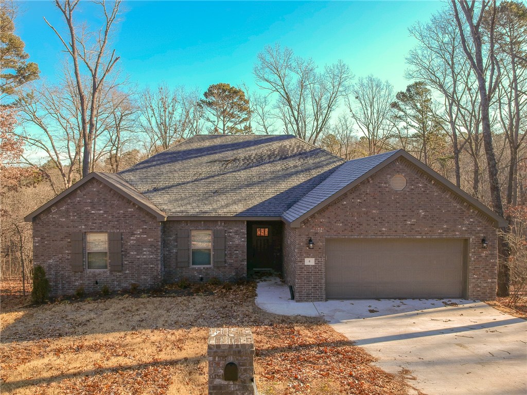 New construction home by RLP Investments. Home features include custom cabinets, granite counter tops, stainless steel appliances, solid surface flooring in living areas, tiles walk-in shower, covered decks, fireplace, and much more! Deck out back with peaceful view! Beautiful home in Bella Vista! Recent price drop!!