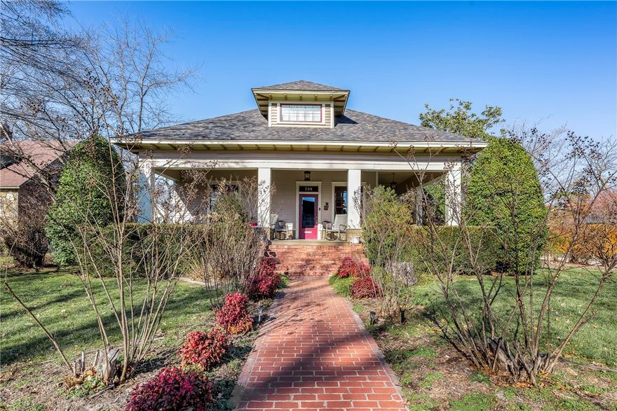 Built in 1913, this iconic Craftsman home is a rare find in downtown Bentonville, just a short walk to the Square. Thoughtfully restored, it retains its timeless character while offering the comfort of modern updates. Step inside to discover fresh paint throughout, new carpet upstairs, and beautifully renewed living spaces that balance historic detail with today’s conveniences.
Recent improvements include a new roof, new HVAC systems, and numerous interior updates that ensure peace of mind for years to come. With its inviting front porch, classic Craftsman lines, and private backyard oasis with pool, this home offers both charm and livability in one of the most sought-after locations in Northwest Arkansas.  New photos coming soon!