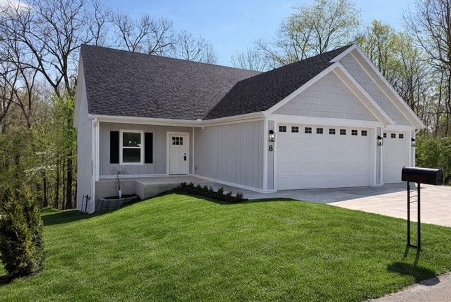 Welcome to your suburban sanctuary! Stylish 3 bed 2 bath split plan house on SEWER boasts sleek modern finishes & abundant natural light thru the PELLA windows with 2" wood blinds & a 3 car garage. Enjoy the gourmet kitchen & savor your morning coffee on the covered deck where nature unfolds before your eyes. Nestled in one of the most desirable Bella Vista locations, nearby to Bella Vista & Bentonville services, trails & parks. An elegant entry way leads to a large great room with fireplace. Further in you will find the kitchen with over sized island open to living, dining & back patio. Relax on the covered back deck & enjoy a phenomenal, usable backyard with mature trees. The spacious owners retreat features a spa-like HUGE walk-in shower & high end finishes. Off the kitchen is a large pantry & laundry.  All this within minutes to Bentonville, Walmart headquarters & Bella Vista shopping, Largo Vista trail - 3 doors away & others nearby.  NOTE: Grass virtually turned green and furniture virtually staged