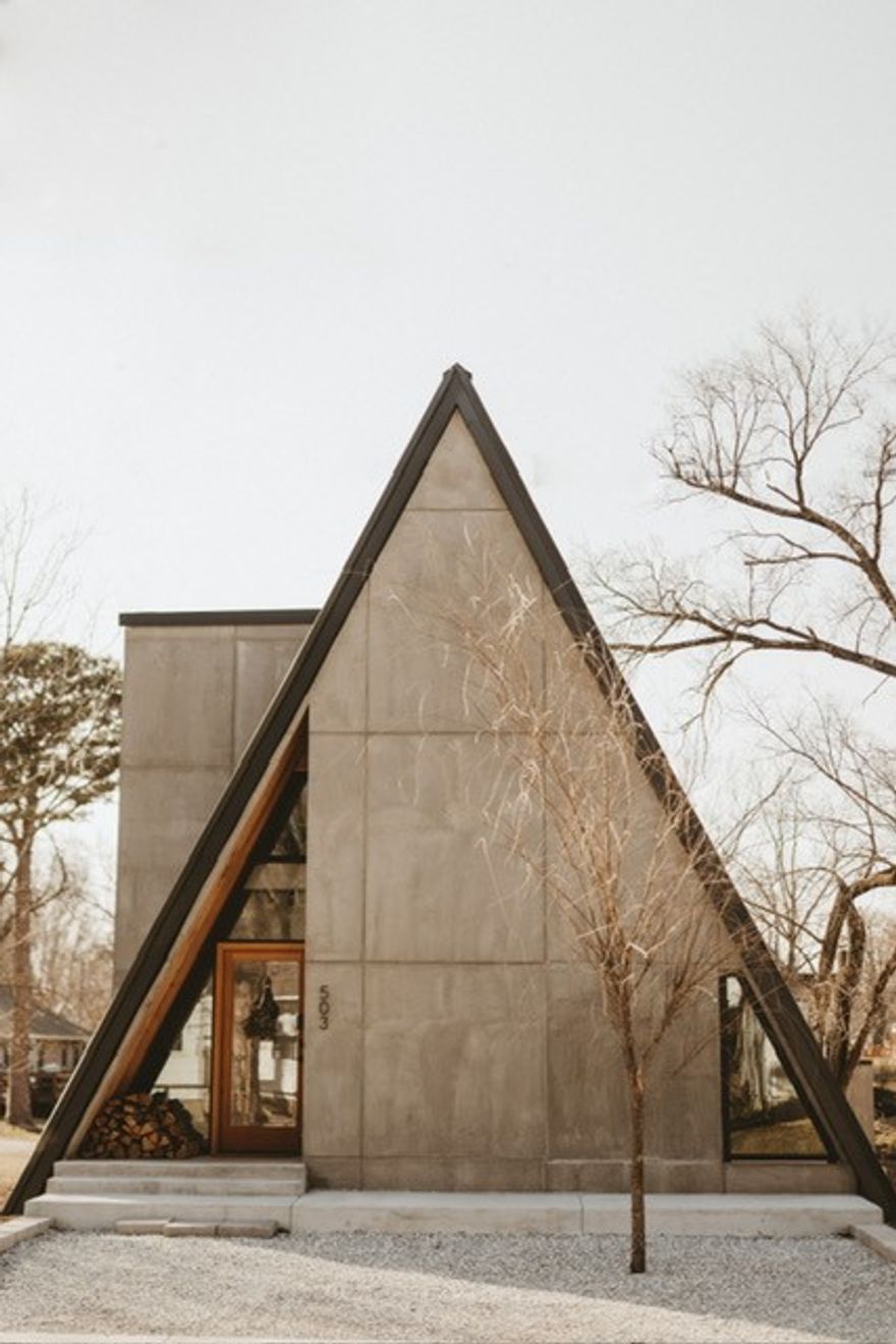This architecturally unique A-frame home in downtown Bentonville offers a rare investment opportunity. Located minutes from Bentonville Square, Crystal Bridges Museum, Walmart Headquarters, and popular MTB trailheads, it’s perfect for outdoor enthusiasts and urban adventurers. The 3-story main home features a chef’s kitchen with a 6-burner gas stove, open-concept dining areas, a half bath, and a cozy living space. Mini-split systems ensure efficient heating and cooling. The lower level includes a luxurious master suite with a king bed, spa-like bath with walk-in shower and soaking tub, plus a private living space with theater-like amenities and walkout patio access. The top floor has a spacious bedroom with two queen beds and a full bath. The property also features a 700 sq ft detached 2-bedroom guesthouse. With a proven track record as a successful short-term rental, this home is a rare opportunity in downtown Bentonville. Furnishings may be included with an acceptable offer.