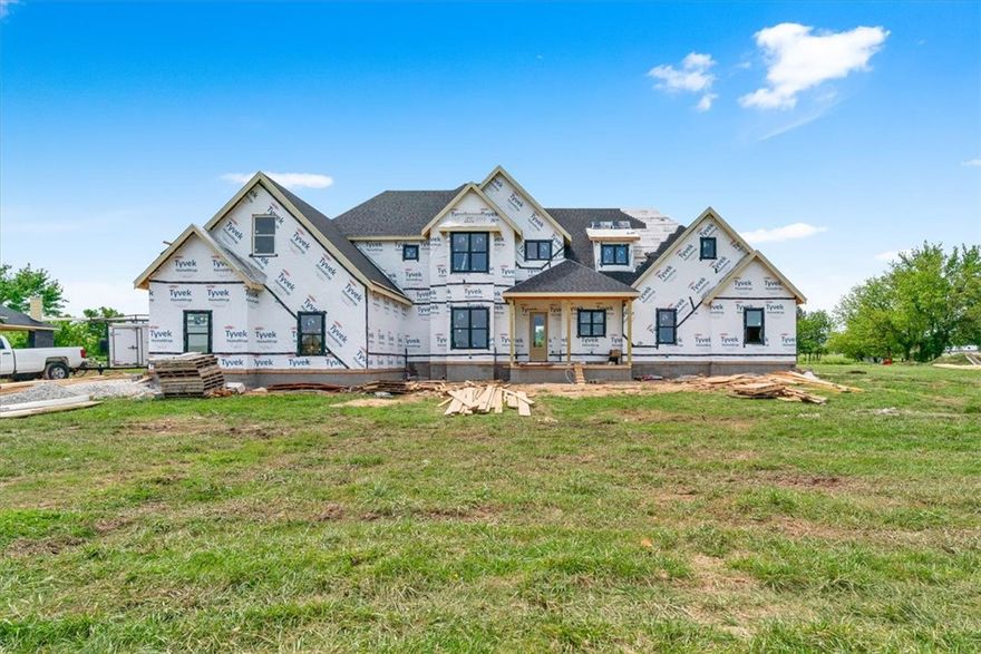 Look forward to coming home to Springdale's newest subdivision, Magnolia Meadows off Harmon Rd
Fayetteville address, Springdale Schools, near Tontitown. One acre lots, 3 car garage, 3200-3800 sq ft
homes planned. Just getting started but this home has 4 bedrooms, 3.5 bathroom, study and media room.
Front porch, back deck and all the spaces you need. Sprinkler system in the sodded areas of the yard as well.  Come check it out.