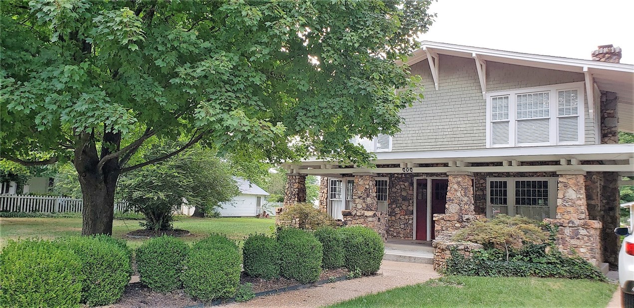 Beautiful Historic home within walking distance of the Bentonville Square and trails. This home has it all 3 bedrooms and an office, plus it has been well preserved through the years. With a cozy layout, great sunroom, tons of windows throughout and a great back yard make this home perfect.