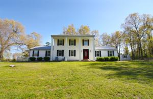 BEAUTIFUL SETTING on this 2-Story Farmhouse! Sitting on 8+ acres near the Woolum Access to the Buffalo River! This home has 3BR/2.5BA and sits on some fantastic pasture land w/ a great country setting on a paved road! Land boasts 2 nice ponds, one of which sits behind the home and is stocked with catfish & has wooden bridges built all the way around it! Nice 30'X50' metal outbuilding w/ electric ran to it, a concrete floor, & 4 garage doors! HUGE Master Bedroom w/ his & her closets and double doors that open up onto the deck over looking the stocked pond! The main floor has a large living room, big kitchen area, dedicated dining room, and a large Den or Rec Room! Kitchen opens to a TERRIFIC patio area that is perfect for grilling out and entertaining!