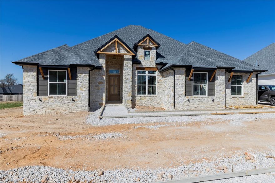 Welcome to elevated new construction in the highly desirable Big Sky subdivision. This 4-bedroom, 3-bathroom home with a spacious bonus room offers a seamless blend of comfort, design, and craftsmanship all on one story. Thoughtfully curated finishes set the tone throughout, including striking high-end wood cabinetry and a chef-inspired kitchen featuring a premium range and oven. The open-concept layout flows effortlessly into the main living area, highlighted by a statement indoor fireplace and tiled. Designed for both everyday living and entertaining, the covered back patio extends your space outdoors, complete with a cozy outdoor fireplace for year-round enjoyment. This Big Sky home delivers the luxury lifestyle you’ve been looking for.