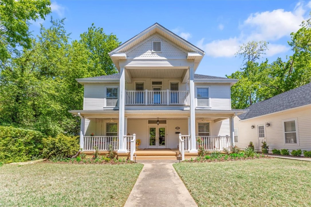 Welcome to this stunning 5br/3ba home located in the heart of Fayetteville's historical district. This home is situated on a half acre lot with plenty of space for outdoor activities and relaxation. The house features a 2 car garage with a workshop. Hardwood floors through out, an unfinished attic for tons of storage, new roof, surround sound, and tankless hot water heater to ensure a comfortable and modern living experience. With two walk in pantries, you'll have plenty of space for all of your culinary needs. Updated primary bedroom/bathroom, 2 living areas and a formal dining room. This house is truly a gem offering a blend of modern updates and historical charm with close proximity to the Razorback Greenway, downtown, shopping, and restaurants. Don't miss out on the opportunity to call this place your home. New roof in 2022 and new tankless hot water heater. Washer, dyer, refrigerator, kitchen island, and entry way closets, convey.