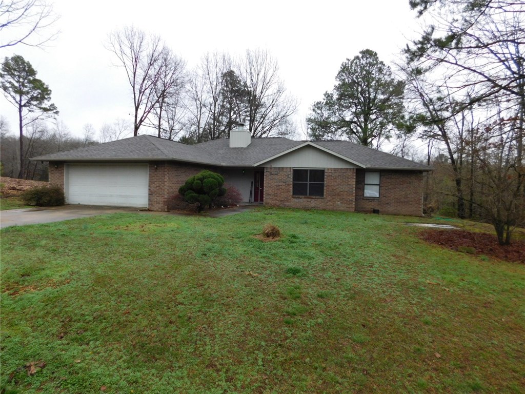 This one-owner brick home at the end of a cul-de-sac is in extremely good condition. Very quiet, private setting conveniently located close to Hwy 71, the lakes and golf courses. New luxury vinyl plank flooring, new fireplace insert, new interior and exterior paint, newer dishwasher, 4-ton heat pump, architectural shingles, granite countertops in kitchen and both bathrooms, huge master bedroom and family room, plus lots more - you must see! Tremendous home at a tremendous price! Refrigerator Conveys!