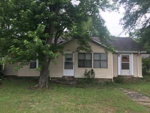 Small town living and a country home on coner lot in Danville. Enclosed front porch and covered porch from garage to house. Currently some wood floors and new flooring in dining, kitchen and bath. Newly painted, 1400 sq ft, 2 BR, 1BA , and storm shelter.