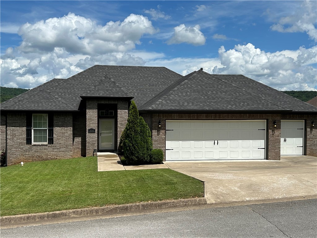 Excellent 4 side brick 1740sf 3br 2ba Home with a 3 Car Garage and covered back deck. This Home has just about everything. 12ft ceiling in entry way, 10ft ceiling in Living area, 9ft ceilings in bedrooms with a box up in the Owners suite, LED can lighting in living room, kitchen, and over tubs / shower in bathrooms, as well as under cabinet lighting in kitchen. This Home also offers a Gas fireplace and a separate shower and jetted tub in the Owners Bath, as well as, separate his and hers closet. Up to $1,000 towards a 1year 2-10 Home Warranty. Schedule a showing and make this home yours today. Showings begin noon 6/29
