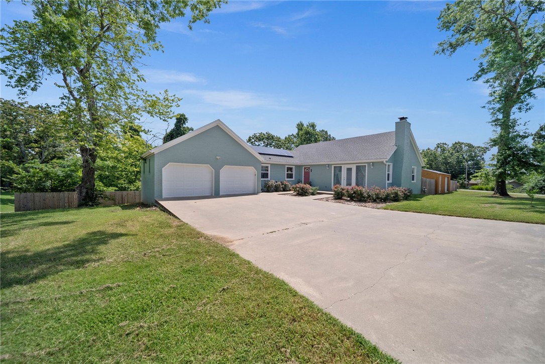 Welcome home! This 5 bedroom 4 bath home boasts a ton of modern amenities while maintaining the charm of an established neighborhood. Easy access to all the dining and entertainment in Downtown Rogers. Equally accessible to Lake Atalanta trail system to unwind in nature. Large kitchen with a suite of stainless steel appliances that all convey with the sale. Open concept between living, dining and kitchen on the main floor. There is 1 primary bedroom and guest room on the main floor and an additional primary suite and two guest rooms downstairs and another separate living space. Unbelievable outdoor space with large, covered deck built in 2024 overlooking the large back yard, and a hot tub on the lower level, which also conveys with sale, all surrounded by a full wood privacy fence. Other features include space for RV and/or boat storage, high voltage EV plug in the oversized 2 car garage, new roof 2020, new downstairs HVAC 2024, solar panels with 25 year warranty installed in 2022, fresh exterior paint in 2024.