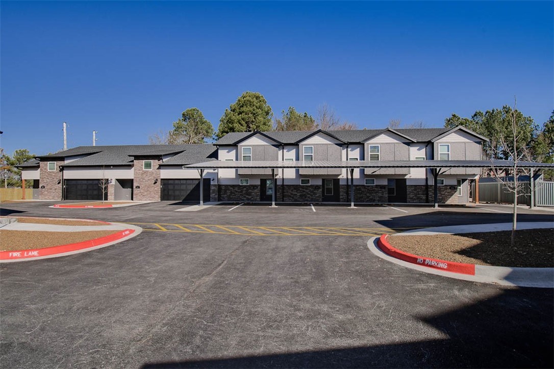 New Construction townhome in perfect Fayetteville location. Close to the U of A, shopping, trails, I-49 & all NWA has to offer! 2 beds, 2.5 baths. Large main floor living area, laundry, ½ bath and kitchen. Bedrooms are located upstairs & have private baths. LVP flooring in main areas, carpet on stairs & in bedrooms; ceiling fans in bedrooms & living room area. Kitchen has all stainless appliances. Refrigerator & full-size washer & dryer are included with sale. Bluetooth speaker system in living area & on covered porch; wifi cameras for security. Two dedicated covered parking spaces with solar lights for added security. Located along UA bus route 35. Acreage listed is for total complex not individual units, individual unit acreage determined by legal description. Each HPR unit will have $600 annual HOA fees for minor maintenance. Entrances are deed ingress and egress at 3 separate locations. HOA documentation available for review. Taxes are estimated and based on what was paid prior to development.