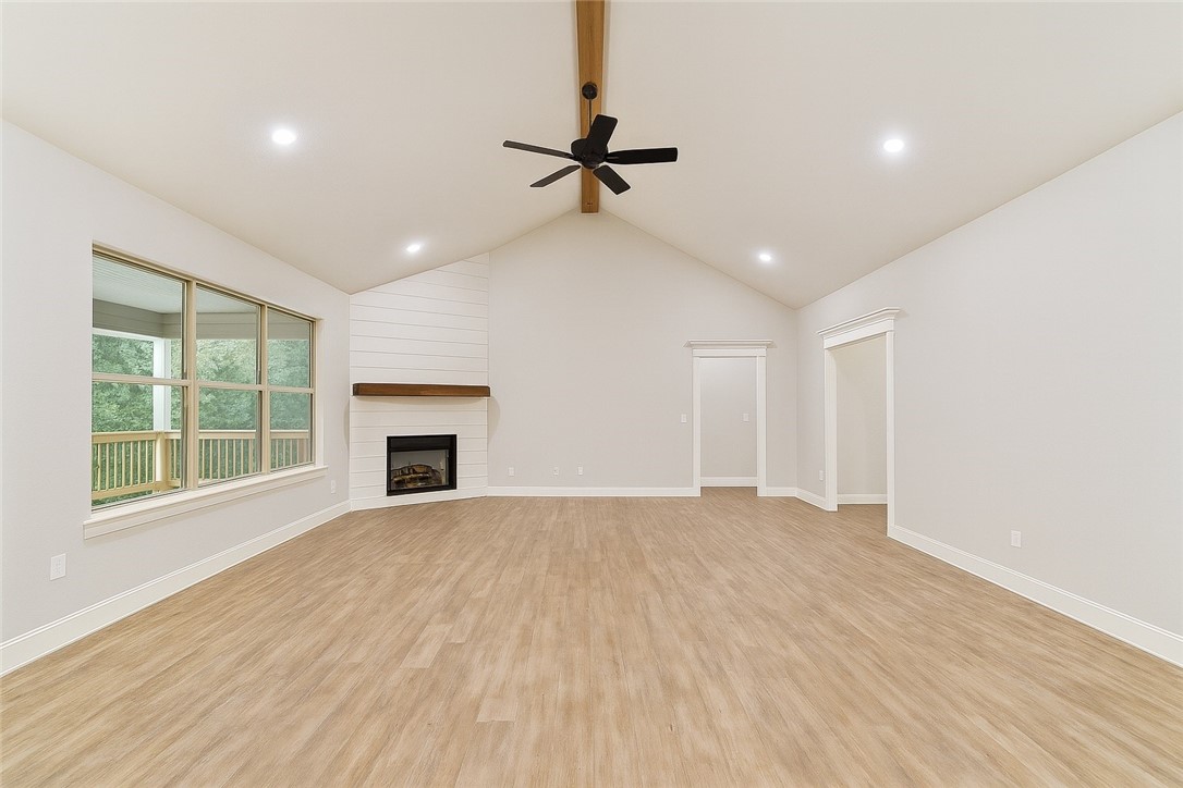 Step inside this stunning 3 bed, 2.5 bath home featuring a split floor plan designed for comfort & privacy. The spacious living area boasts a vaulted ceiling with exposed beam & shiplap fireplace, creating the perfect centerpiece for cozy gatherings. This home is loaded with upgrades, including luxury vinyl plank flooring throughout (carpet only in guest rooms), 3cm granite countertops, & under-cabinet lighting that brightens the stylish kitchen. A dedicated office makes working from home effortless, while the impressive 9x9 walk-in pantry provides ample storage for all your kitchen essentials. The layout offers convenience & functionality, with generously sized bedrooms & timeless finishes thruout. Outside, enjoy fresh landscaping that enhances curb appeal, along with an oversized garage providing plenty of space for vehicles & storage. This home is a rare find—combining thoughtful design, modern finishes, & practical features all in one. **SPECIAL FINANCING INCENTIVES AVAILABLE THRU BUILDER'S PREFERRED LENDER**