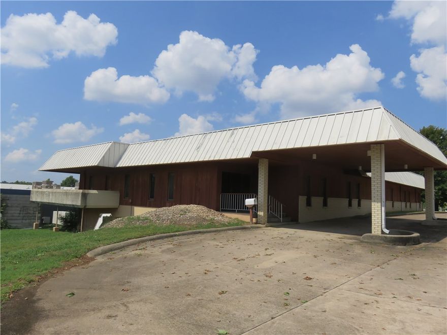 Office Building for sale near the Joyce and College Ave. intersection in North Fayetteville, Arkansas.  The property is at the crossroads of the major business district of Fayetteville and is surrounded by many major retailers, offices and is near Washington Regional Medical Center.  The property conveys with a large half-acre lot that could be developed for additional parking or building expansion.