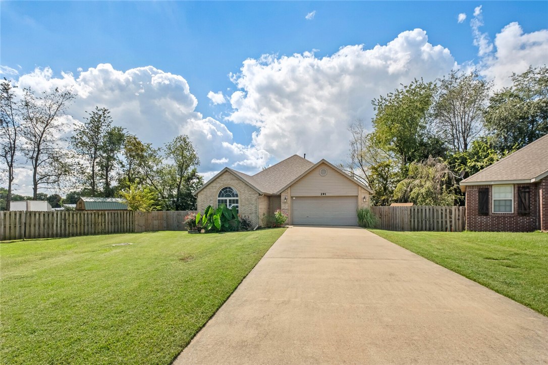 Well-kept home in a great location with a HUGE yard! This home has been very well maintained & updated with all the expensive updates already done! Newer roof (2021), gutters (2020), HVAC (2022), hot water heater (2020), new deck (2022) & new paint throughout! Desirable location at the back of the neighborhood with a nicely landscaped oversized lot, fully fenced and private backyard with a large deck, storage shed, no homes behind you for extra privacy! The split bedroom layout features 3 large bedrooms, the front bedroom has a vaulted ceiling. The living room has high ceilings, crown molding, gas fireplace and an open layout to the kitchen and dining area. The kitchen has a wraparound breakfast bar with bar stool seating, granite counters and all appliances convey! The primary bedroom is HUGE and can easily accommodate a king size bed and seating area, it has a tray ceiling and private bathroom with double sinks and large walk-in closet! Great location in Bentonville schools, close to shopping, easy access to 102.