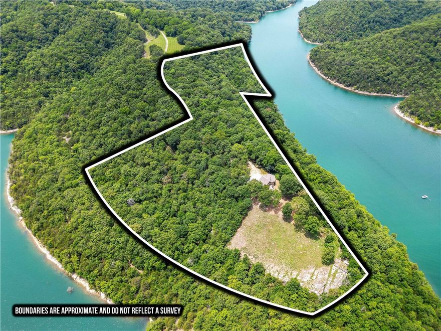 Private Peninsula Estate on Beaver Lake
Tucked on a secluded peninsula at the pristine north end of Beaver Lake, this rare estate offers panoramic views, total privacy, and a mix of shoreline, bluffs, and open forest. A private 30-ft dock grants direct lake access. Hike your own wooded trails or relax above it all with 270° views from the wraparound deck.

Facing Devil’s Eyebrow Natural Area, the custom home features vaulted ceilings, a stone fireplace, and a large primary suite. The walk-out lower level adds a spacious entertaining area, three lakeview bedrooms, second fireplace, kitchenette, laundry, two baths, storage, and a lakeside patio.

Perfect as a full-time residence, fishing retreat, or weekend getaway—this is one of NW Arkansas’s most unique lakefront properties.