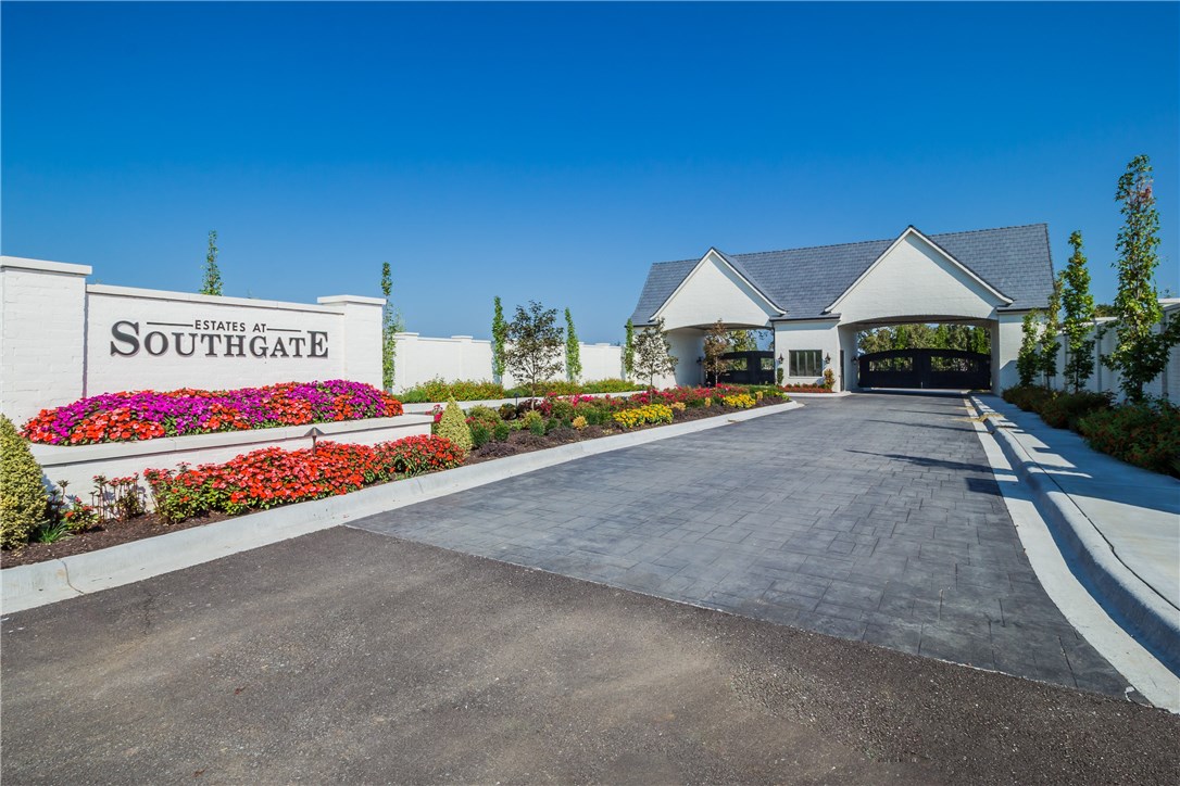 Perfectly set on a level 1 acre corner lot surrounded by meandering rolling hills, water vistas and mature hardwoods. Affording privacy and convenience. Desirable location near the West entrance at The Estates at Southgate. Minutes from top-tier schools, restaurants, shopping and I-49. Bentonville Schools