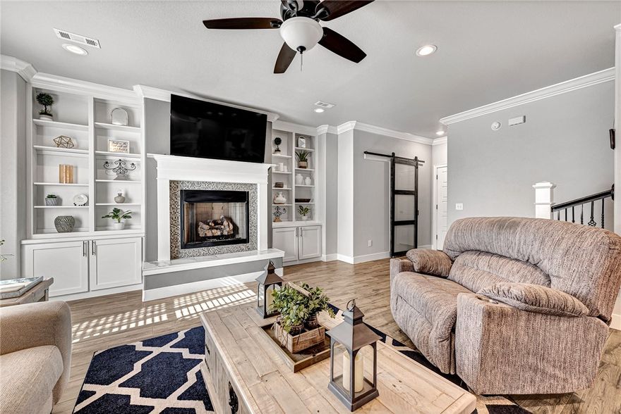 Located in the sought-after Wellington Heights subdivision, this custom energy-efficient 4-bed, 2.5-bath home offers a perfect blend of luxury, functionality & style. The primary suite features a spa-like bathroom w/a soaker tub, custom walk-in shower & huge double closets for ample storage. The spacious living room is accented by a cozy gas log fireplace & built-in floor receptacles for a sleek, tidy look. The gourmet kitchen is a chef's dream w/a gas cooktop, convection oven & high-end fridge that conveys. A charming breakfast nook offers a cozy spot for casual meals, while the formal dining area easily doubles as an office space. Elegant crown molding runs throughout most of the home, adding a touch of sophistication. The tankless water heater & insulated garage ensure comfort & energy efficiency year-round. With thoughtful design & eco-friendly features, this home offers both style & practicality in a prime location. Bentonville schools. Community clubhouse, playground & pool.
