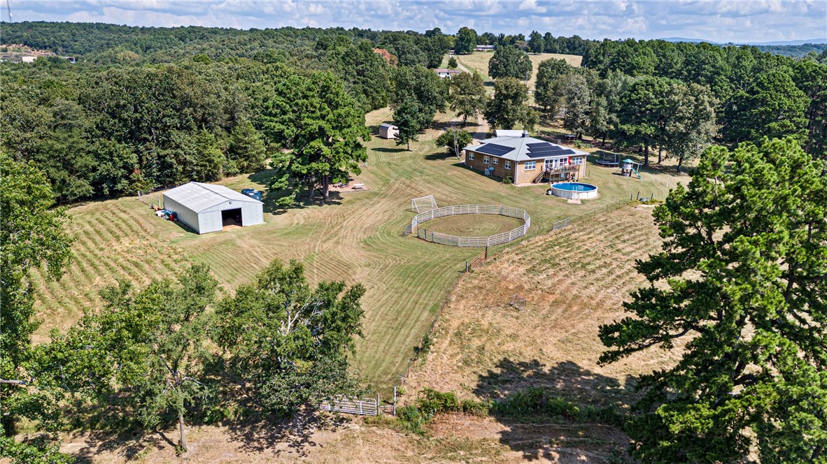Horse and cattle lovers dream. As you crest the gentle driveway, your greeted with a view of the river valley overlooking your 40 acre pasture with cross-fenced fields and a tranquil pond. As you step inside, the home flows with natural light an open-concept living with warm stone tile floors, and finishes that hint at refined ranch elegance. Four bedrooms provide generous space for large families. The master suite greets with a view and a beautifully remodeled shower and soaking tub perfect for relaxation.
Outside, the above-ground pool anchors the outdoor living scene—ideal for cooling off under the sun or enjoying tranquil evenings by water. Nearby stands a practical barn: large enough for equipment or livestock, with 5 stalls, tack rooms or storage areas, all designed for ease and efficiency.
This property unites functionality with beauty—offering a spacious ranch life, elegant modern home comforts, pastoral views, and amenities to live and thrive in this countryside retreat.
