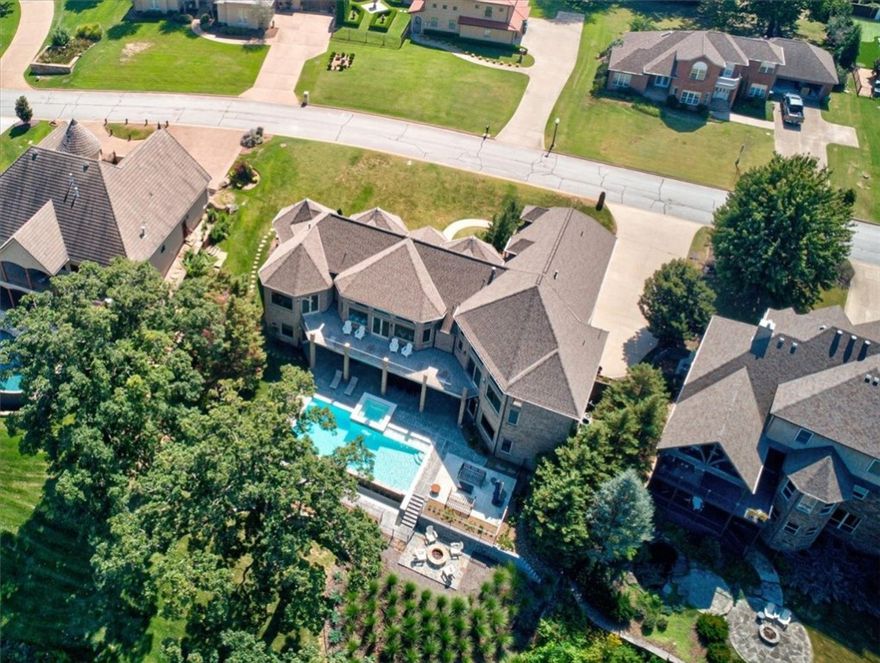 Welcome to this elegant estate in the prestigious gated Pinnacle Golf & Country Club, overlooking the 6th hole of the championship golf course. Stunning home spans an impressive 7,203 sq ft across 3 levels. Inside you’ll be struck by the grandeur of the home’s design with beautiful new hardwood floors, natural light, & picturesque views. Well-appointed kitchen boasts top-of -the-line appliances & large quartz island, ensuring a delightful culinary experience. Library with floor-to-ceiling built-ins is perfect for relaxing, while adjacent office provides a dedicated space for working. Finished basement offers access to infinity saltwater gunite pool & spa, outdoor built-in cooking & grill area, & inviting fire pit to enjoy on those cool evenings. A perfect place to unwind, entertain guests, or simply bask in the serenity of your private oasis. Sitting on a .54-acre lot that is beautifully landscaped, this impeccable home is the pinnacle of luxury living. Don’t miss the opportunity to make this dream estate your own.