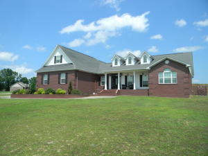 Custom throughout! Come see this beautiful 3 bed 2.5 bath home sitting on a large 2 acre lot just minutes from town. From the beautiful floors to the custom designed kitchen to the huge privacy fenced back yard you will love this home. Other custom features include quartz and granite counters throughout, upper-end stainless appliances, a bonus/theater room, an office area off of the living room, built-in surround sound speakers, and an additional garage bay door for lawnmower/atv parking or use as a workshop. You will enjoy the energy savings with blown cellulose 2x6 exterior walls. Call today for your personal viewing.