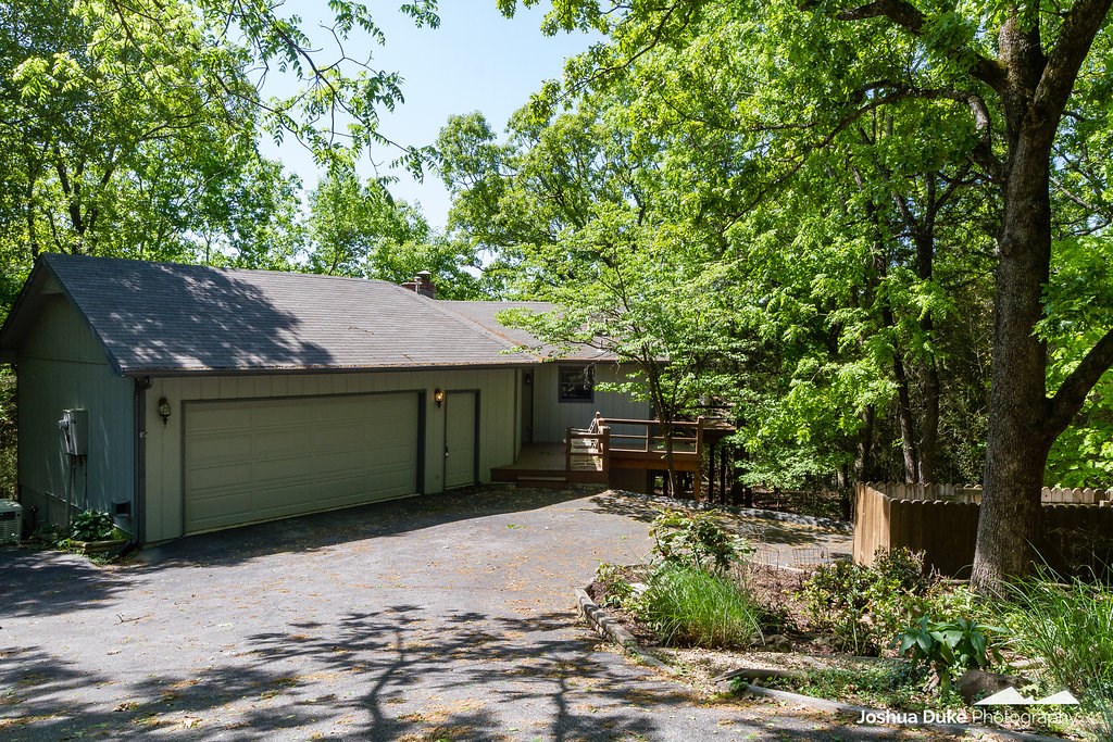 Lake Front with a Private Boat Dock, 2 boat slips, w/lifts. An Easy walk to the water is a RARE FIND. 4 bedrooms, main level living with sun room. Deck accessible from living area. Whole house GENERAC. Attached large 2 car garage, with easy entry. Extra places to park in concrete driveway. Maintenance free yard and gardens. No Lake View. Custom Built , One Owner Home.
