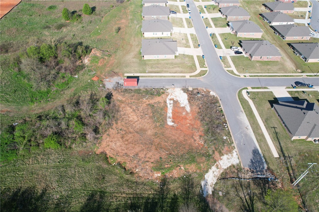 Exceptional multifamily development opportunity at the epicenter of Northwest Arkansas's explosive growth. This lot is ready to build on with roads and infrastructure complete. This strategically located property sits within one of the nation's most dynamic markets, where over 40 people move to NWA daily in 2025. As Walmart's headquarters and home to Crystal Bridges Museum, Bentonville offers world-class amenities, premier mountain biking trails, and a thriving downtown square. The multifamily market is positioned for steady growth driven by robust economic fundamentals and sustained rental demand from workforce migration. With Arkansas being the most moved-to state and Bentonville leading as the region's economic engine, this property represents a rare chance to capitalize on unprecedented regional expansion in America's fastest-growing economic hub.