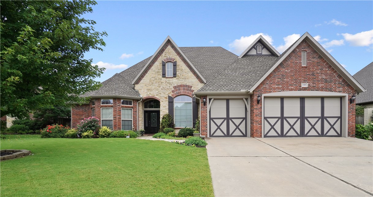 Custom home with great curb appeal located in the popular Bent Tree subdivision. Bent Tree is in the heartbeat of Northwest Arkansas with close I49 access, Top Golf, the Amp, Promenade shopping and restaurants. Property is beautifully landscaped with sprinkler system, backyard fence and a new roof and gutters installed in April 2020. Includes custom cobblestone front entry sidewalk along with custom built-in shelves, pillars and ceiling beams. Includes a grand entry foyer. Includes a vaulted cathedral ceiling in the living room that highlights unique architecture by builder Jim Jones and was showcased in the NWA Parade of Homes. Includes hardwood floors in many rooms. This house plan brings in natural light and includes a gorgeous, dedicated office featuring built-in shelving, wood flooring, and a wood ceiling. Has open concept kitchen, informal dining and living room, ceiling detail and an over-sized fireplace.