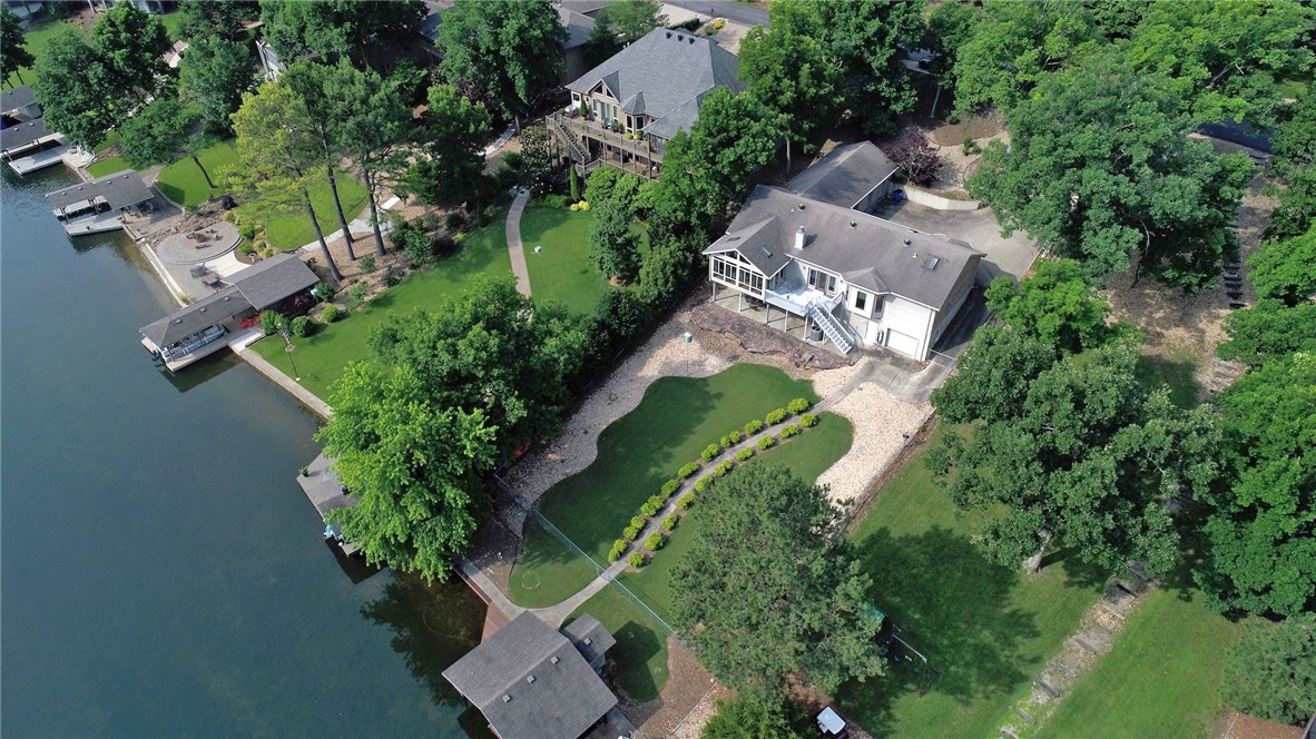 If it is the view you want, this house is for you! Located on Loch Lomond with your own private, double boat dock, gently sloped backyard and gorgeous landscaping. This well maintained home has a fully finished basement, large eat in kitchen built for entertaining, beautiful hardwood floors throughout, heated and cooled Sunroom, Cedar closet in the basement and lots of storage. The workshop is located in the basement with a smaller garage door to the outside and is heated and cooled.
