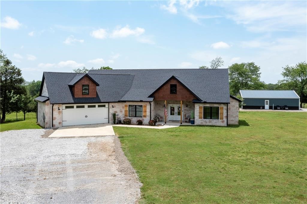 Welcome to your private slice of country paradise! Nestled on a sprawling 2-acre corner lot, this meticulously crafted farmhouse-style home combines rustic elegance, with modern functionality. There are two bedrooms on each wing of the house, creating an ideal setup for privacy. The kitchen is a chefās dream, featuring sleek quartz countertops, a double oven, farmhouse-style sink, ample pantry space, soft close cabinets and a cozy pellet stove to keep things toasty on chilly evenings. The primary suite is a true retreat, complete with a luxurious soaking tub and an expansive walk-in closet. Having visitors, whether itās a quick stopover or an extended stay, your guests that are traveling by RV, will feel right at home thanks to the RV hookups on the property. Also, they can stay in the 30x40 finished shop, which includes two fully finished rooms, a full bathroom, and laundry hookups, while delivering a full guesthouseāāāāāāāāāāāāāāāāāāāāāāāāāāāāāāāā experience.