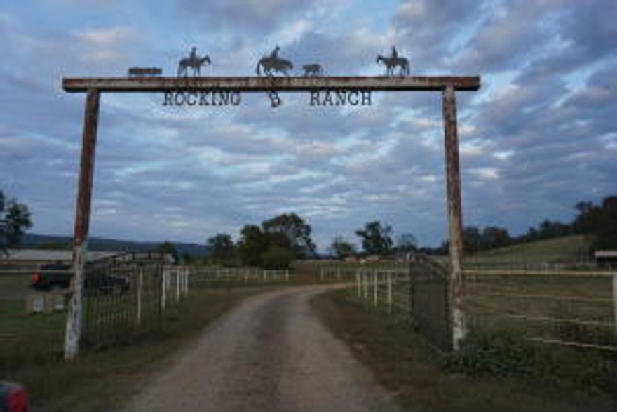 Very Rare Opportunity to own your own cattle/horse ranch complete with the perfect spot on a hill to build your dream home overlooking the Magazine Mountain Range, or live in the 1096 SQ FT home already on the property. There are numerous well manicured pastures, several with their own run in sheds, water & electricity. The property is fenced and cross fenced and has over 1 1/2 miles of  pipe fencing throughout the property. Multiple outbuildings, working pens & 40x400 horse barn includes11 Priefert stalls & feeders each complete with their own electricity & water.There are several water wells on the property  along with city water. There are 6 ponds, some of them stocked for fishing or you can fish the Petit Jean River which borders the property as well.
