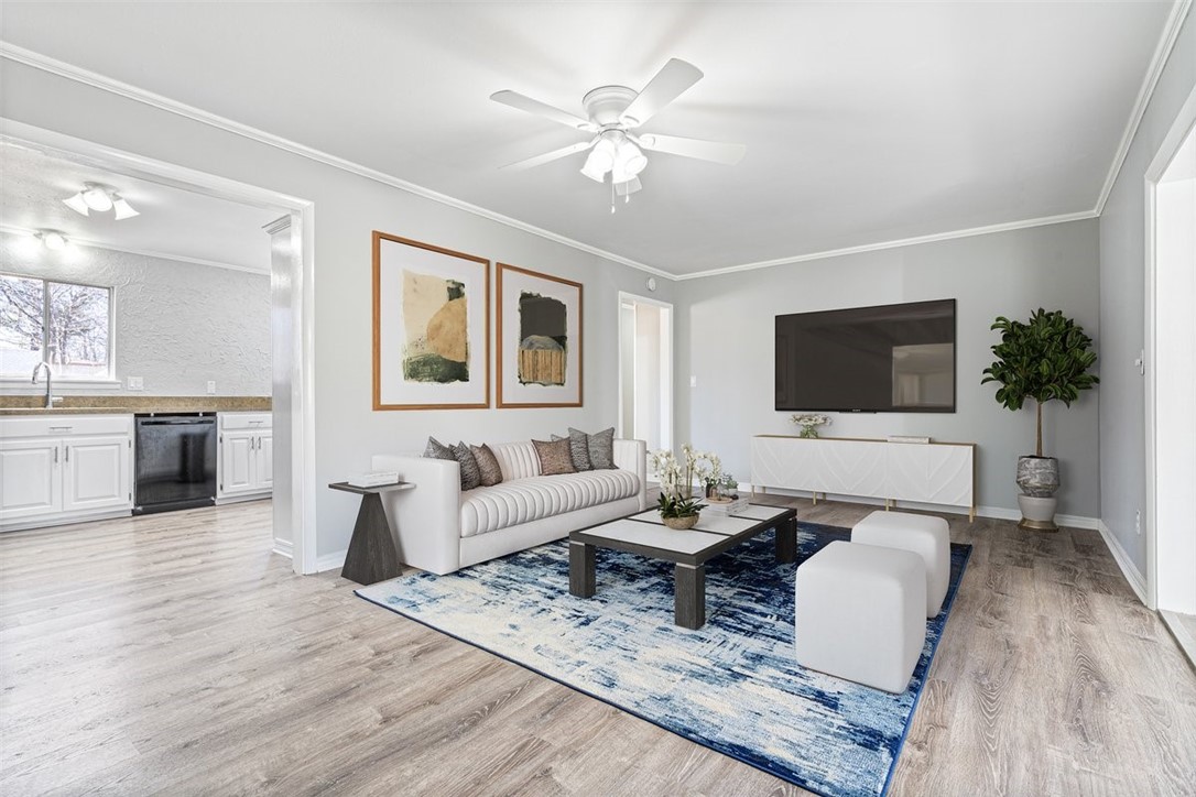 Beautifully-renovated home in a PRIME Fayetteville location! Just steps away from Poplar Bikeway & a minute to the Razorback Greenway, 5-min. drive to the Univ. of Arkansas, walking distance to Razorback Transit stops & Woodland Junior High, and convenient to all restaurants and shops on HWY 71! Enjoy peace of mind in this move-in ready 3-bedroom home with New roof (2021), new kitchen appliances (2023), new flooring (with lifetime warranty!) throughout entire home, plus new baseboard trim, new crown moulding, new closet wardrobe systems in all bedrooms, new light fixtures in every room, new interior & exterior paint, and all new interior & exterior doors (including new hardware!). Relax in the bonus living area while enjoying the wood-burning stove. Prefer to be outside? This house has a great wrap-around deck that overlooks the expansive backyard, complete with perfect area for a firepit. Mature trees provide abundant shade, and the extra-wide driveway provides parking for multiple vehicles. Sold As-Is.